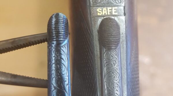Heat bluing top safety catch before and after